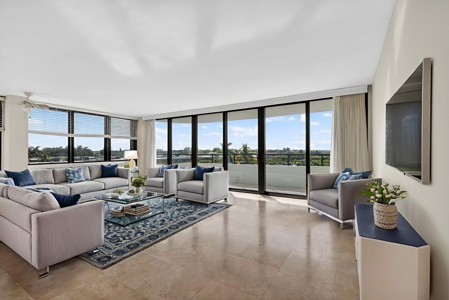 Exceptional Value. Elevated Coastal Living. Complete Peace of Mind! Enjoy this corner residence at Mayfair House — where all major building work is done: Structural Integrity and Reserve Study completed, concrete restoration finished, plumbing updated, brand-new elevators, fully funded reserves, no assessments and approved for financing. This expansive 1,541 sq. ft. two-bedroom corner unit is favored for its natural light, privacy and stunning sunset views. Large windows and Sliders surround the expansive living area, creating a bright, open space perfect for both entertaining and everyday comfort. Travertine floors, impact windows and shutters, fresh paint, updated baths, and generous storage complete the package. The split floor plan offers ideal separation, with a spacious primary suite featuring patio access, a walk-in closet and an updated ensuite bath. Granite countertops and wood cabinetry enhance the kitchen's timeless appeal. Residents enjoy refreshed grounds, pool, fitness room, deeded beach access and  24/7 manned front desk  all in the heart of South Palm Beach, a walker's and cyclist's paradise. Just steps to Plaza Del Mar (Publix, boutiques, dining) and across from the renowned Eau Spa. Only 20 minutes to Palm Beach International Airport. This isn't just a condo  it's effortless coastal living at an exceptional price.