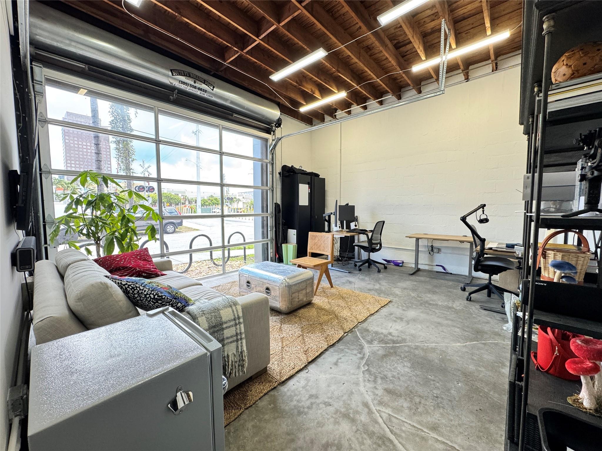 Creative space is rarely available in the back of Wells Coffee Shop. Appointment only. Very cool roll-up door and high ceilings. Perfect for a photography studio and many other professional uses. A big bonus is that you have access to the best coffee in town!