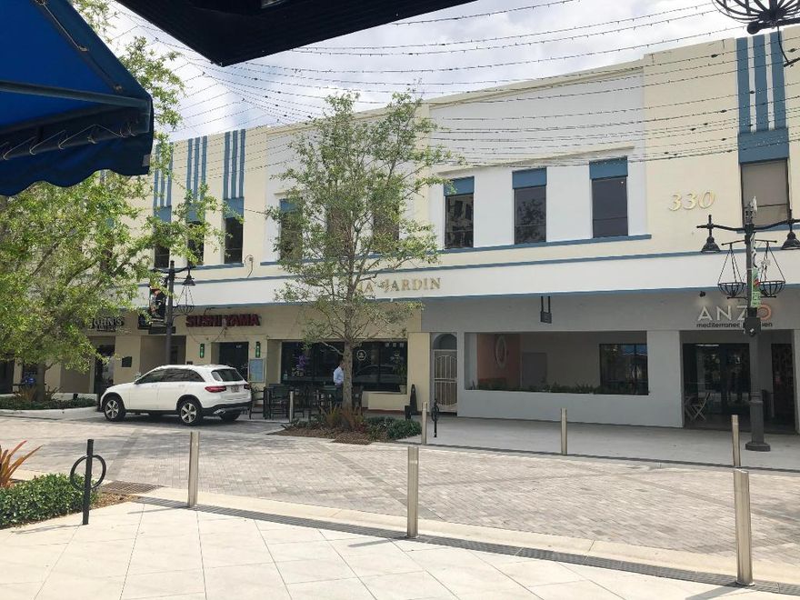 PRICE IMPROVEMENT-Recently Updated Professional Office Space for lease in the Via Jardin building.  This Light and bright unit Includes 5 offices, a conference room, large open work space, storage and 2 entrances.  Via Jardiin is centrally located on the Main Street of downtown West Palm Beach: Clematis Street: A beautiful 2 story office and retail building is just a  few minutes walk from the new Brightline train station, courthouse, city hall, the Mandela Public Library & many restaurants/businesses. Complemented by a bright airy, shaded interior courtyard with an attractive fountain & seating providing an inviting lunch spot or meeting spot. Tenant pays electric & janitorial service. Unit can be divided into 2-888 sq ft office suites. Parking includes city surface parking/garages & stre