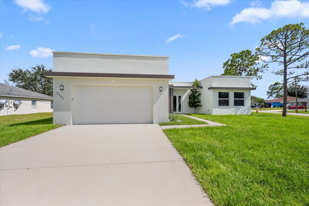 Photo of 2291 SW Plymouth Street, Port Saint Lucie, FL 34953 (MLS # R10929041)