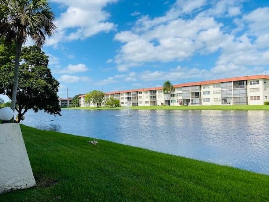 FIRST FLOOR LARGE PHASE V. Beautiful Lake and Golf views. 2BR/2BA Eat-in kitchen; North-South Exposure; Tiled throughout.  Tons of built-ins including 2 Murphy beds to accommodate lots of company, wall-to-wall extra storage  (dresser/cabinet) in Master Bedroom, 2 desks, and more. RECREATION LEASE PAID UP IN FULL! 24 hr guard gated 55+ community. FREE GOLF (EXCEPT FOR CART FEES). Two 18 hole golf courses (Championship PGA + Par 3), 14 tennis courts, 7 heated pools, theater, fitness center, pool & ping pong tables, Pickle Ball and Bocci courts, restaurant, courtesy bus, sauna, car wash, electric car charging station, BBQ's, shuffleboard. GREAT HOLLYBROOK LIFESTYLE! ENJOY BREAKFAST OR YOUR FAVORITE BEVERAGE ON YOUR LARGE PATIO OVERLOOKING A LARGE LAKE AND PAR 3 GOLF GREEN!