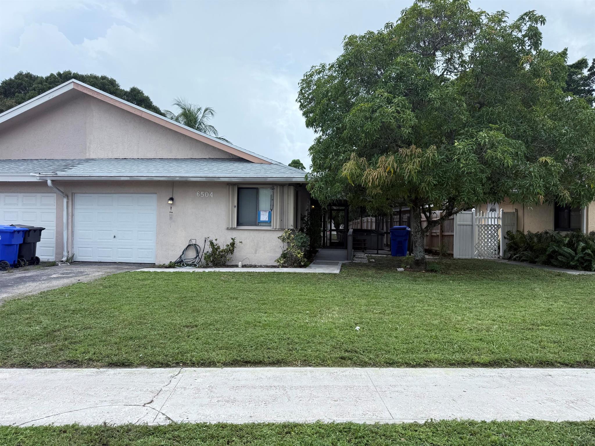 3/2 1 Car Garage Waterfront 1/2 Duplex home. With NO HOA.  The garage has been partially converted to an extra room but can be easily converted back.  Suitable for a man cave, 4th bedroom or office.  BRAND NEW ROOF installed August 2025. Close to everything and well maintained.  Accordion shutters on all windows with a hurricane impact front door.  Great home for a first-time buyer. Very private with its own backyard on the water.  This home is also handicap accessible with a front door ramp and a handicap accessible bathroom.  Can be removed if not needed.