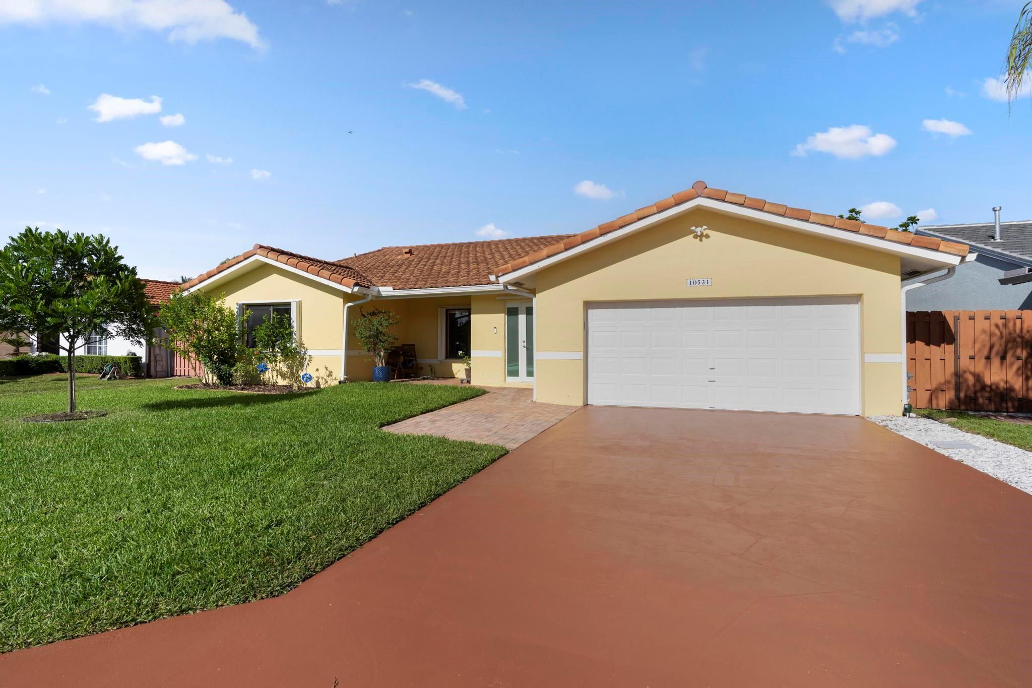 Don’t miss this opportunity to own a beautifully updated 3-bedroom, 2.5-bath home in the highly sought-after Oakwood at the Hammocks community. This spacious residence boasts an expansive layout—larger than the 4-bedroom models in the neighborhood—features high ceilings, open-concept design, and an abundance of natural light. Enjoy stylish updates including modern flooring, upgraded kitchen cabinets, and recessed lighting. The oversized primary suite features vaulted ceilings and a spacious en-suite bathroom. Step outside to your private, screened-in patio and pool, turf yard, and lush landscaping—perfect for entertaining or letting kids play. Additional highlights include a 2 car garage, extra driveway parking, and prime location near A+ schools, major expressways and shopping.