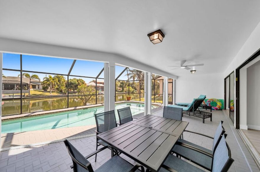 Live the Florida lifestyle in this beautifully renovated waterfront home in sought-after SW Cape Coral. This spacious 3BR/3BA residence features a bright, open layout and a private screened-in pool overlooking a peaceful freshwater canal—perfect for relaxing or entertaining. With modern finishes, updated kitchen appliances, Smart TVs, storm shutters, and designer touches throughout. Fully furnished and move-in ready. Flexible lease options available, including seasonal or month-to-month. Pets welcome with approval. Enjoy quiet surroundings, scenic water views, and the ultimate Florida retreat.