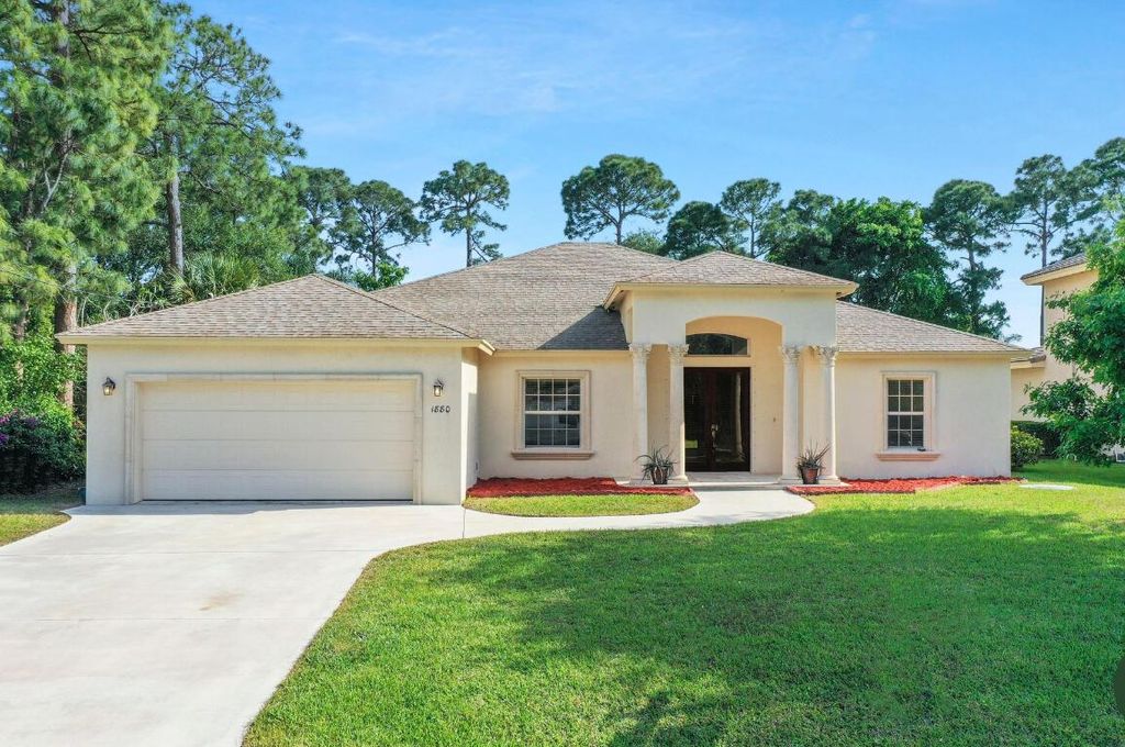 Photo of 1880 SW Millikin Avenue, Port Saint Lucie, FL 34953 (MLS # R10970504)