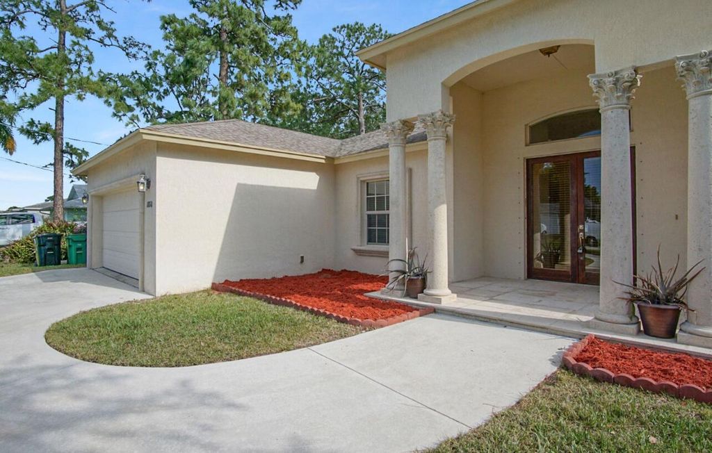 Photo of 1880 SW Millikin Avenue, Port Saint Lucie, FL 34953 (MLS # R10970504)