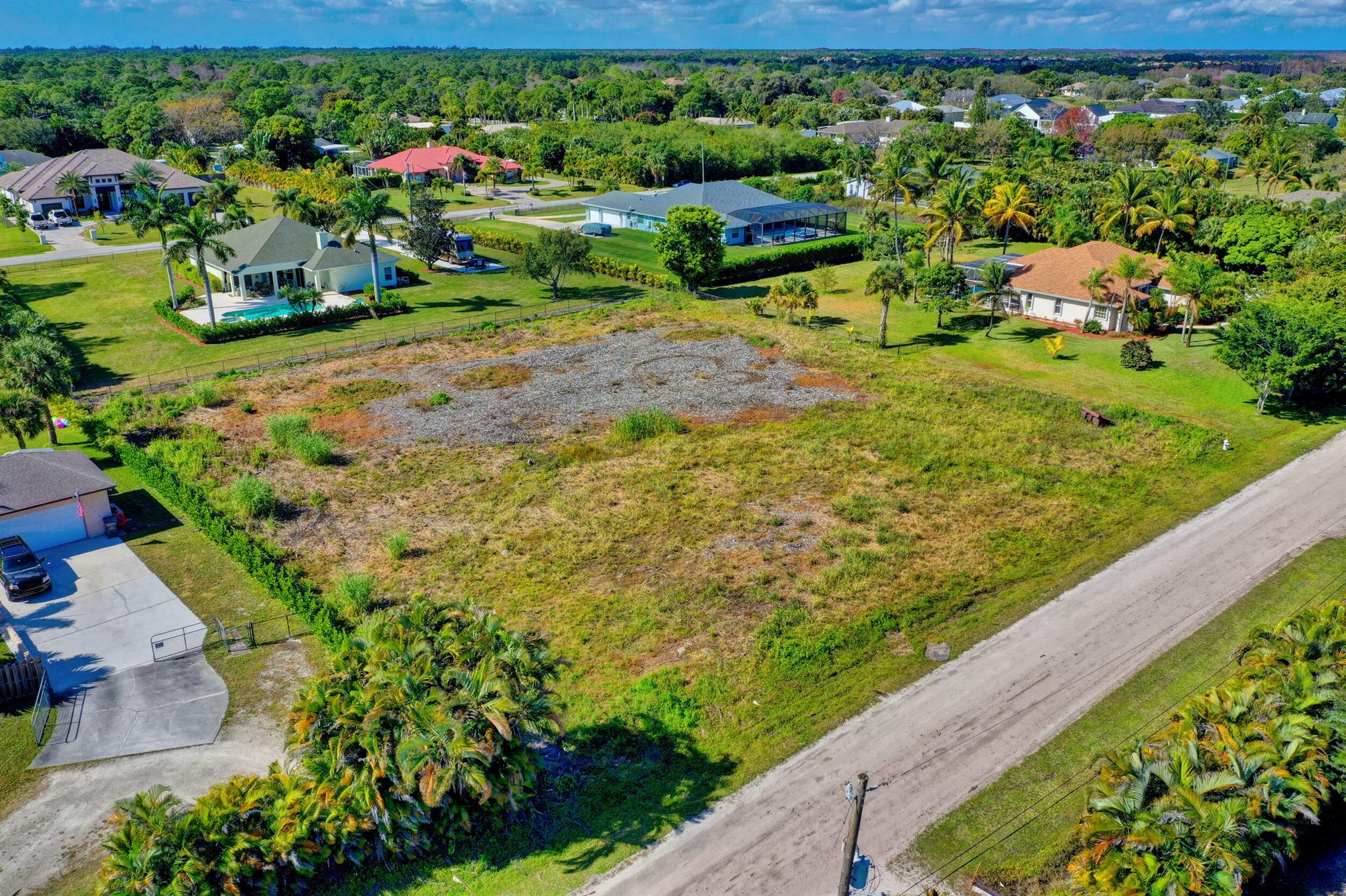 In the heart of Palm Beach Country Estates, this vacant lot is a blank canvas for your next masterpiece. With 1.15 acres of cleared land and plenty of room for a pool and guest house, this property has all the space you need to create your dream home. All in all, this is one of the quietest streets around! The property is also listed for sale with a British West Indies Model, it's a must see beauty. For pricing and details, please refer to MLS #RX-10832958.