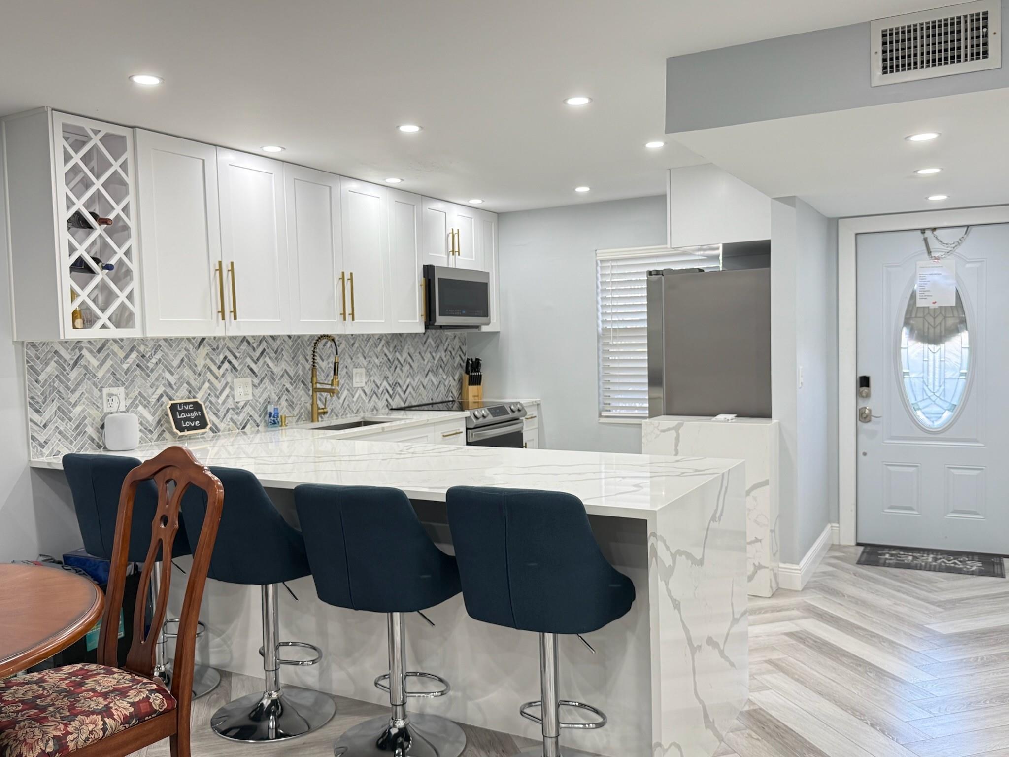 Welcome to modern living at 7300 NW 5 Place #103! This newly remodeled condo in Margate boasts a chic design and is priced to sell. Enjoy the seamless flow of the open-concept layout, perfect for entertaining and cozy living. The condo features a stylish, updated kitchen outfitted with contemporary finishes and modern bathrooms that combine elegance and functionality. It comes FULLY FURNISHED, offering you a turnkey experience. Centrally located near shopping, dining, and parks, this beautiful residence is the ideal place to call home. THE COMPLEX IS ACROSS THE STREET FROM THE BRAND NEW PUBLIX. SHORT DRIVE TO THE BEACH. ASSSOCIATION STATES 55+, 675+ CREDIT, $35,000+ INCOME, 20% DOWN, THOUGH SOME LENDERDS REQUIRE 25%, SECURITY DEPOSIT AND IN PERSON INTERVIEW. ACT FAST. THIS WON'T LAST!