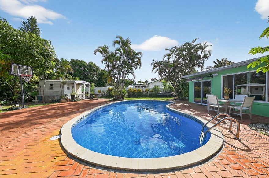 Welcome to this beautifully renovated and fully furnished 3-bedroom, 2-bathroom home for lease, nestled on a quiet cul-de-sac in Jupiter. Recently updated with a brand-new roof and fresh exterior paint (2024), this residence is move-in ready and designed for comfort and style. Inside, you'll find a bright and welcoming layout with hurricane-impact windows, elegant finishes, and thoughtful upgrades. The master bathroom features a travertine shower, while the second bathroom is accented with slate tile. A lovely Florida room provides the perfect spot to relax or entertain year-round. Outdoors, the lush backyard is a private retreat with a sparkling pool and ample space for entertaining under the Florida sun. The extended driveway offers plenty of parking, and