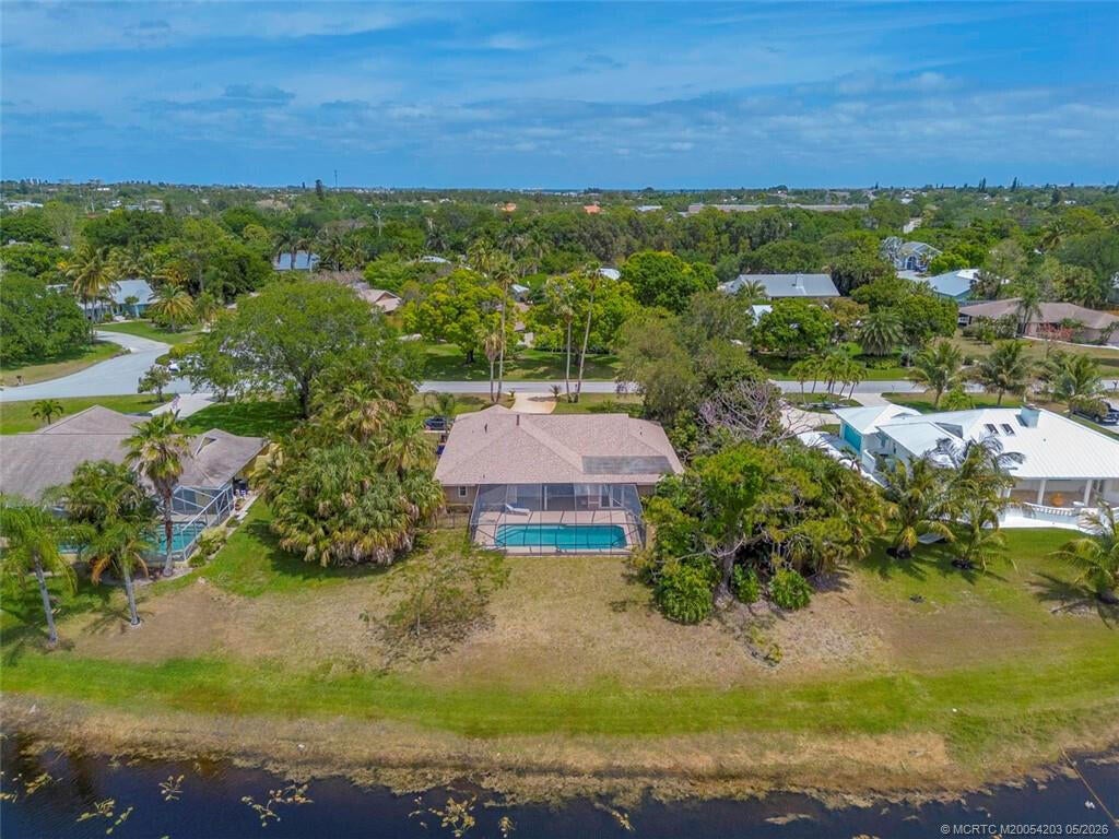 Photo of 3074 NE Loquat Lane, Jensen Beach, FL 34957 (MLS # B26064333)