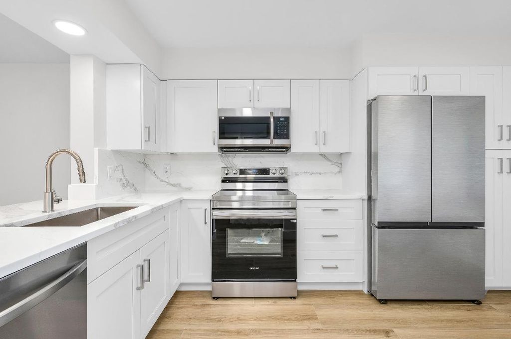 Photo of 7290 Kinghurst Drive #301, Delray Beach, FL 33446 (MLS # R11155116)