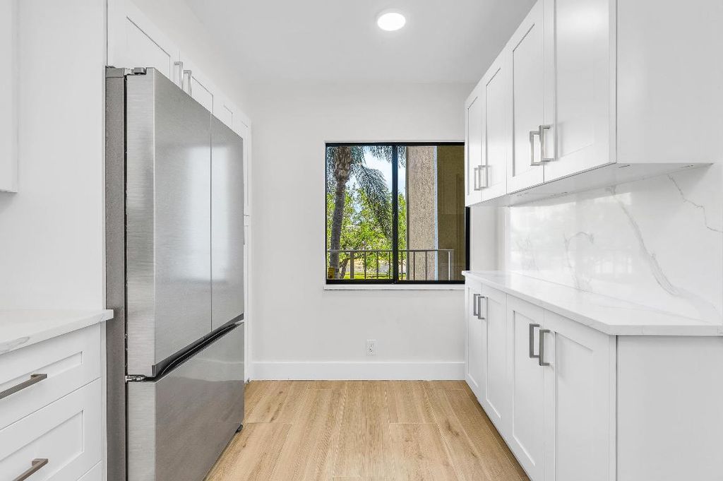 Photo of 7290 Kinghurst Drive #301, Delray Beach, FL 33446 (MLS # R11155116)