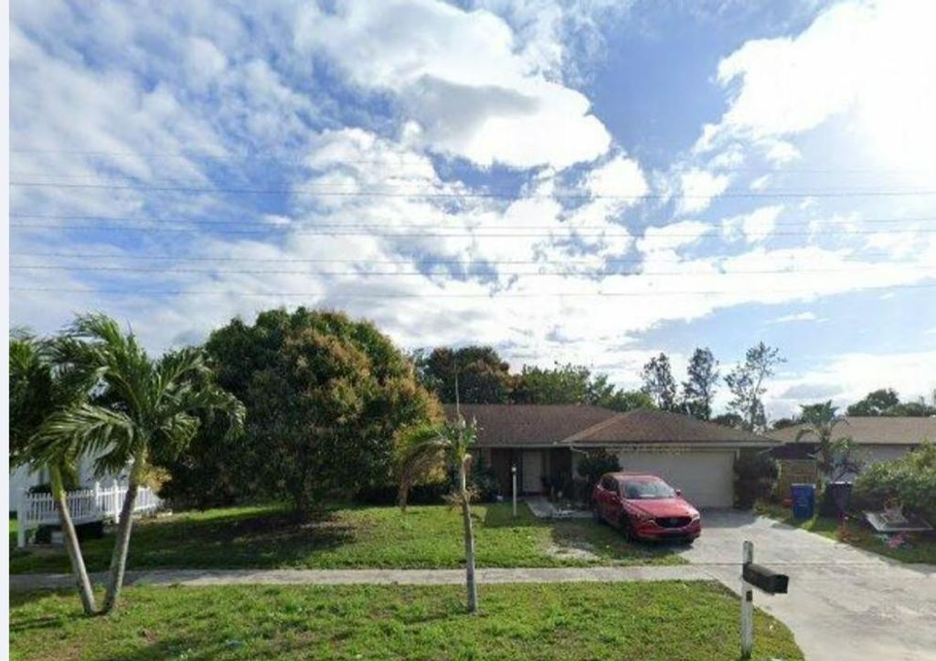 Photo of 2551 Canterbury Drive, Riviera Beach, FL 33407 (MLS # F10546266)