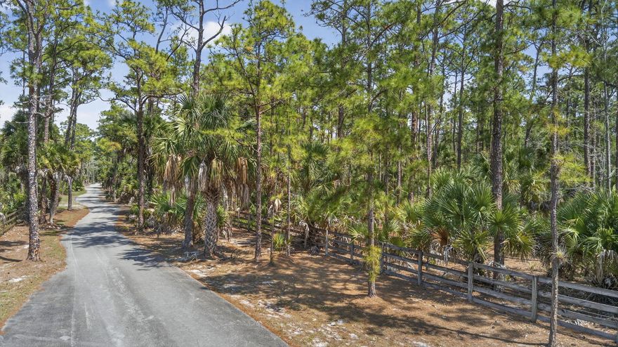 LIVE IN BEAUTIFUL FOX TRAIL!  THIS EQUESTRIAN COMMUNITY IS A PARADISE.  THIS 5 ACRE LOT IS PINE STUDDED, HIGH AND DRY.  BORDERED TO THE EAST BY A LOVELY FISH FILLED CANAL.  FOX TRAIL CONTAINS 29 MILES OF DEDICATED HORSE TRAILS.  ITS PRIVATE PAVED ROADS WINDING THROUGH THE COMMUNITY GIVE YOU A FEELING OF BEING IN OLD FLORIDA.  ONLY 211 LOTS IN ALL OF FOX TRAIL.  THIS IS ONE OF THE LAST REMAINING VACANT LOTS.  CLOSE TO GREAT SHOPPING, EQUESTRIAN VENUES BUT YET PEACEFUL AND SERENE.  FOX TRAIL IS THE BEST KEPT SECRET IN PALM BEACH COUNTY. PROPERTY CURRENTLY IS AGRICULTURALLY CLASSIFIED.