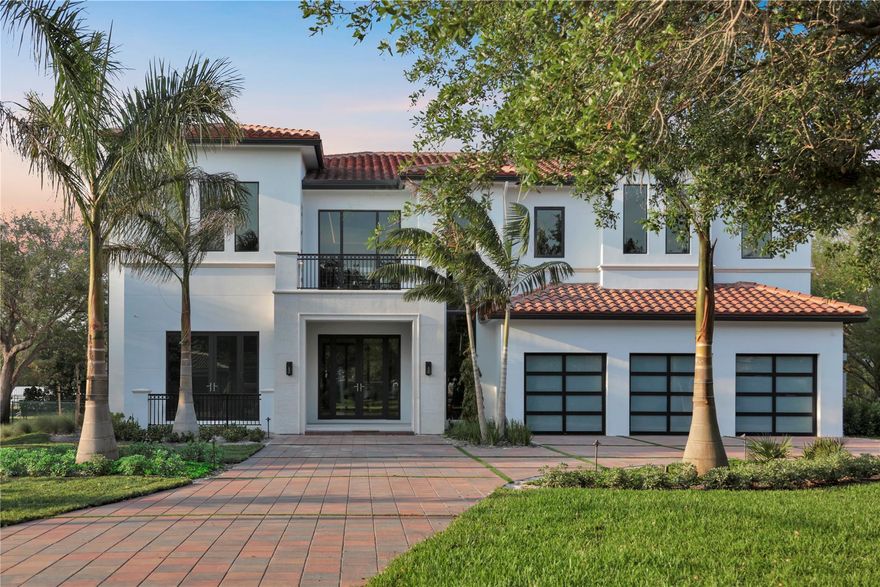 Experience true luxury in this brand-new two-story estate, perfectly situated at the end of a cul-de-sac on a lush acre homesite. Designed by a renowned architect and crafted by Landmark Luxury Homes, no detail was overlooked. Over 7,500 square feet of cutting-edge smart home living includes a state-of-the-art sound system, modern finishes, and high-end materials that surpass the competition. Enjoy a resort-style backyard with a sleek modern pool, expansive covered patio, and custom stone decking—offering privacy, elegance, and unmatched comfort in every corner.