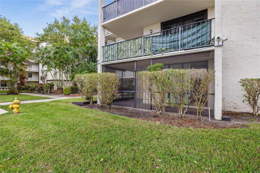 Photo of 6190 Woodlands Boulevard #111, Tamarac, FL 33319 (MLS # F10549030)