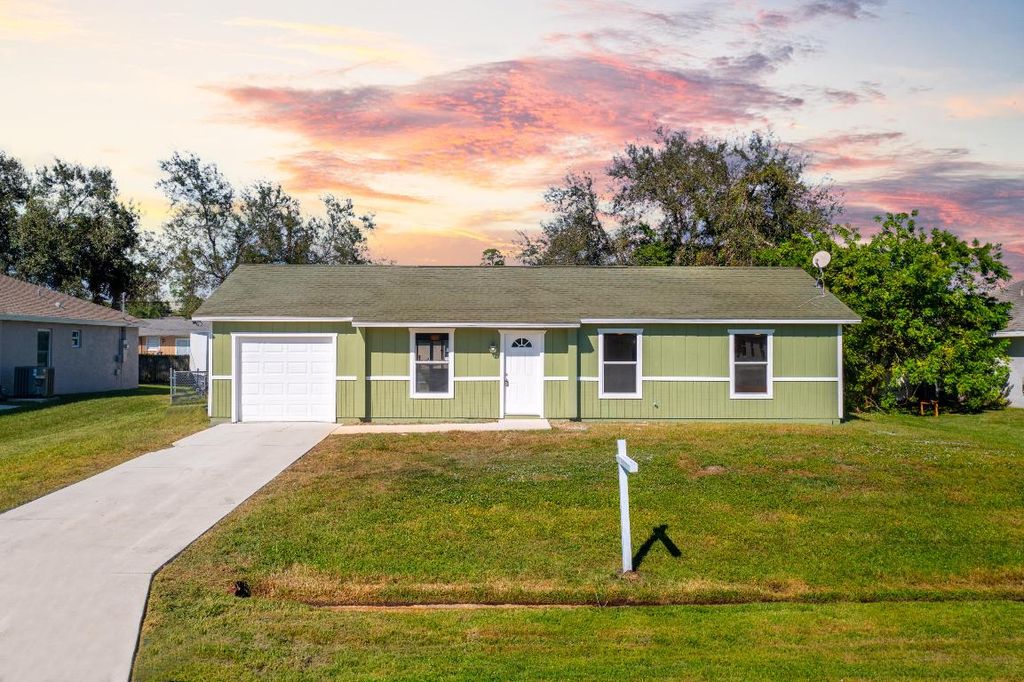 Photo of 1133 SW Sudder Avenue, Port Saint Lucie, FL 34953 (MLS # R10933321)