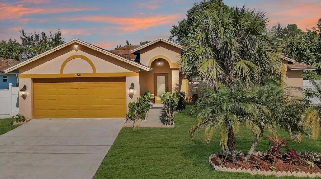 Photo of 1341 SW Axtell Avenue, Port St Lucie, FL 34953 (MLS # R10868522)