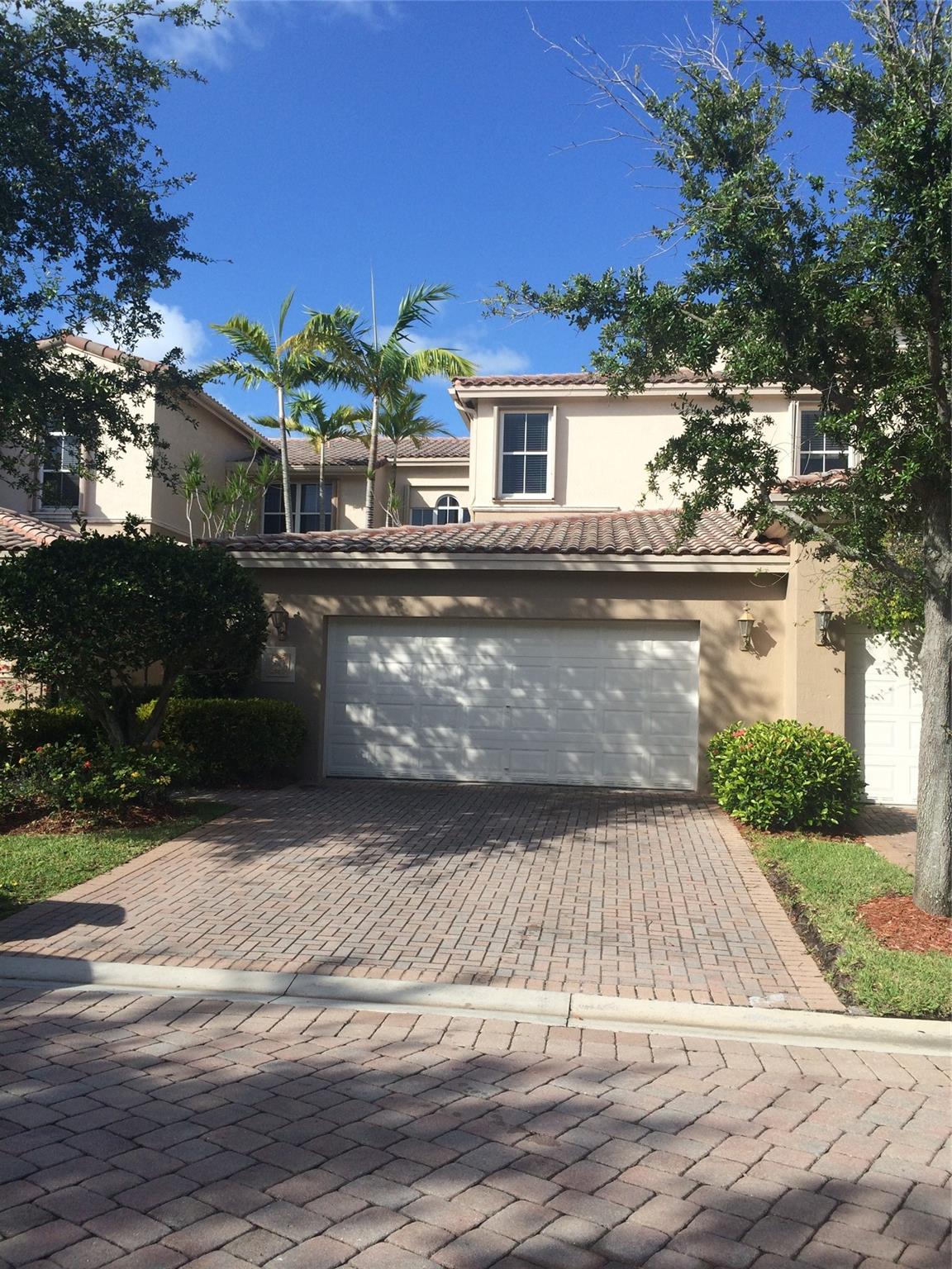 Tastefully designed townhome in outstanding condition. Wake up in your huge bedroom with spacious his & hers walk-in closets and large master bath. Step out into the loft, that's being used however you'd like, & find the guest bedroom suite (also with its own full bathroom) across the way. Downstairs is where you will find the elegant kitchen, separate formal dining and living room, laundry room, the patio & 2-car garage. First floor also features the other guest bedroom & a full bathroom (ideal for any family member with issues with stairs). South Florida living 5 minutes from the beach in a secure & gated community. Association features two pools, tennis/pickleball/basketball courts & gym. Currently tenant occupied & available September 1st. Unit to be professionally cleaned & painted.