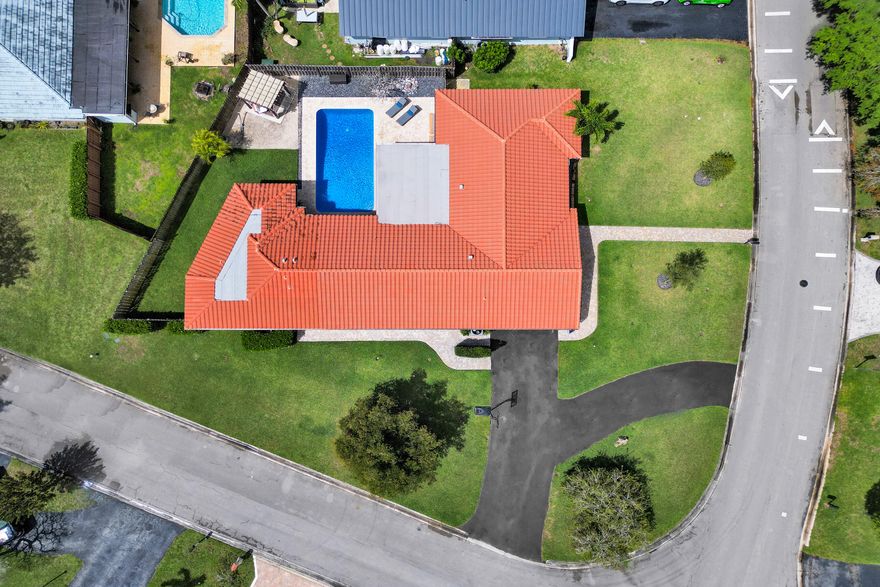 Rarely offered 6-bedroom, 3-bath Coral Springs gem on a 13,501 sq ft corner lot with NO HOA! Includes a private addition with its own bedroom and full bath perfect as a guest suite, in-law quarters, or pool house. Step outside to your own backyard oasis with refinished saltwater pool, new diamond brite, updated coping, travertine patio, heater, and pergola ideal for entertaining year-round. Inside, you'll find thoughtful upgrades throughout, including hurricane impact windows, updated master shower, newer washer/dryer, full home repipe (2 yrs), and 2018 roof. Circular driveway, 2-car garage, and paved walkways complete the curb appeal. Whether you're hosting or growing, this home checks every box with space, upgrades, and flexibility in one of Coral Springs' most desirable areas!