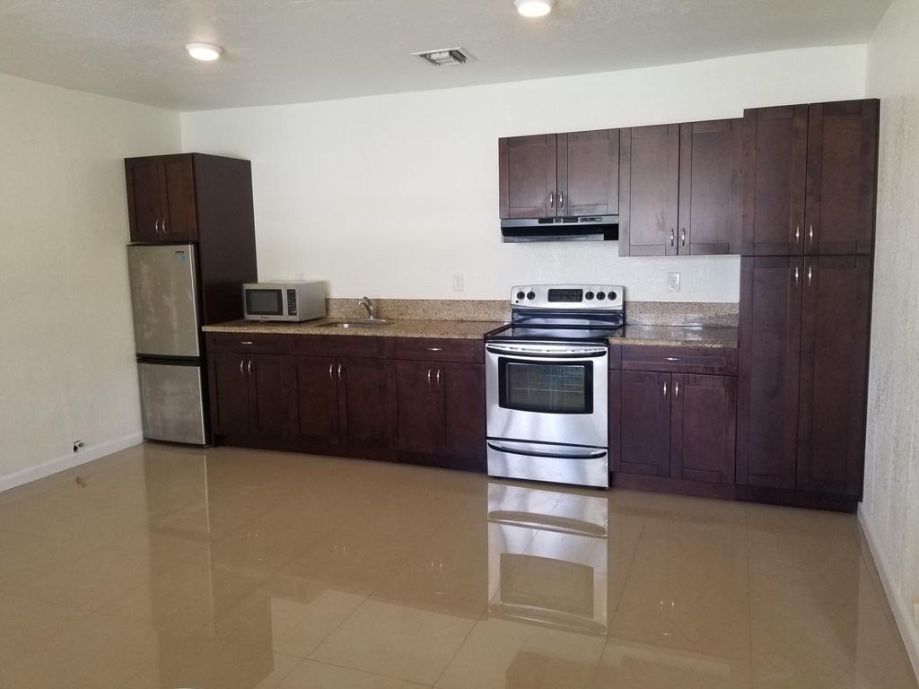 Photo of 703 NW 6th Street #A, Hallandale Beach, FL 33009 (MLS # B26024971)