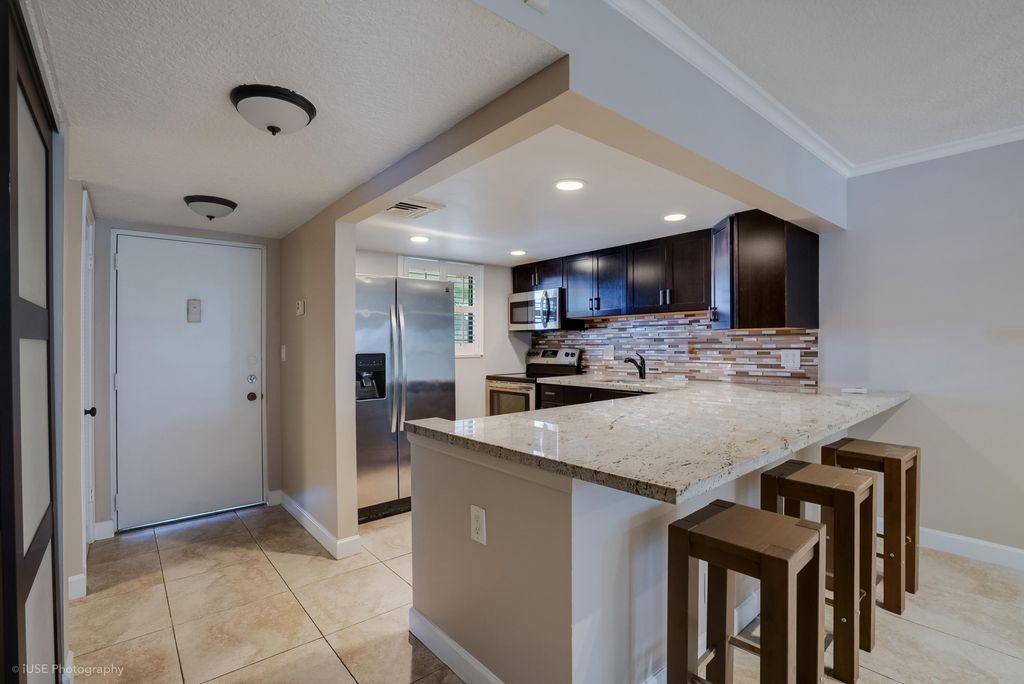 Photo of 2314 S Cypress Bend Drive #Unit 313, Pompano Beach, FL 33069 (MLS # B26019289)