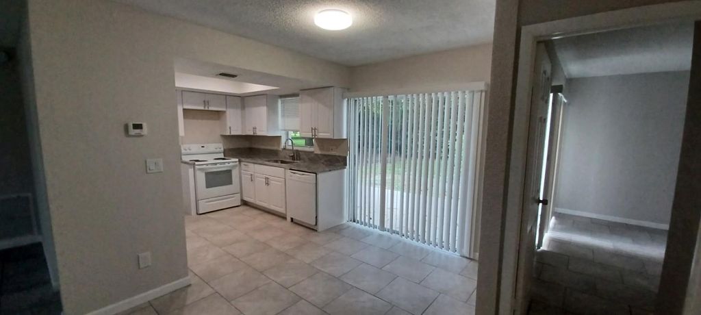Photo of 235 NE Summer Road, Port Saint Lucie, FL 34983 (MLS # F10412525)