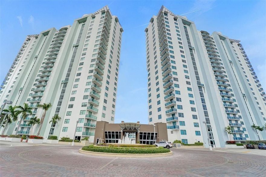 Two-bedroom, two-bathroom unit at Tao Sawgrass, featuring a split floor plan. This unit boasts brand new laminated wood flooring in the bedrooms and has been freshly painted in neutral tones. The living room and kitchen have tile floors, with granite and marble countertops. The unit includes a washer and dryer. The master bathroom offers a separate soaking tub and shower, with slate and marble finishes. This fully furnished unit is available for month-to-month or full-year rental and offers an expansive lake view. It comes with two assigned parking spaces. It is within walking distance to Sawgrass Mills Mall and Panther Stadium. Tao Sawgrass offers a range of amenities, including a resort-style pool, gym, game room, putting green, and more. This unit is a must-see!