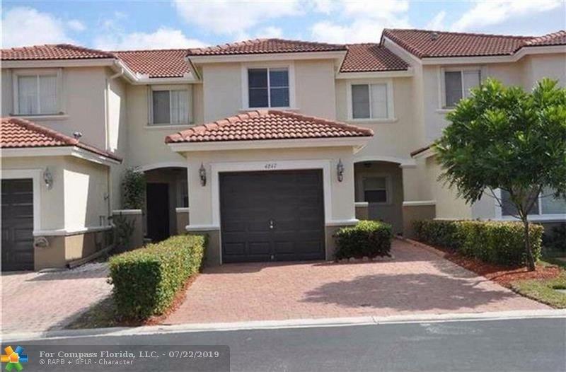 Beautiful lakefront & updated 3 bedrooms/2.5 Bathrooms Townhouse located in the gated community of Dimensions at Doral. Amazing Lake view. Tile throughout the First and Second Floor, wood floors on the stairs. Renovated kitchen with granite countertops and stainless steel appliances. All offers are welcome. Centrally located, quick access to major expressways, malls, etc. Great school zoning. Pets welcome, even large dogs!. This one will not last! One of the best deals in Doral!