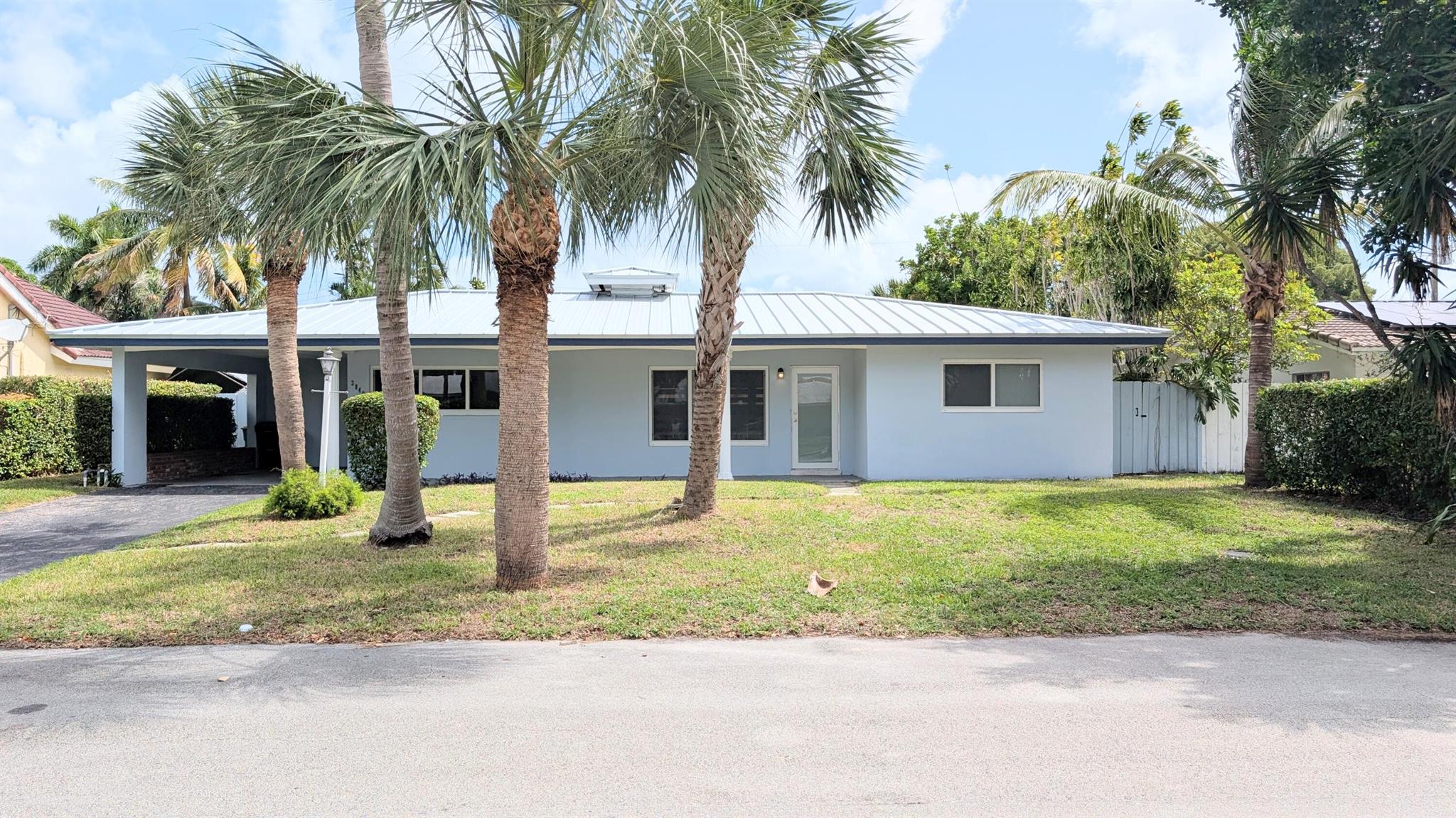 Welcome to Lighthouse Point, a community known for its quiet streets, coastal charm, and proximity to the Intracoastal Waterway. This beautifully updated 3-bedroom, 2-bath home is move-in ready and designed for comfortable Florida living.Recent upgrades provide peace of mind, including a new metal roof (2022), impact windows, a new hot water heater, plus newer HVAC, electrical panel, and pool equipment. Inside, the home features porcelain tile throughout, creating a seamless flow and enhancing the open layout filled with natural light.Step outside to a large backyard with a sparkling pool, perfect for entertaining, relaxing, or enjoying year-round sunshine.