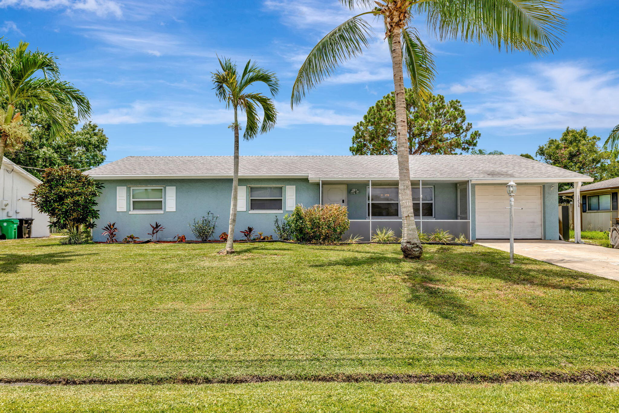 Welcome to this charming & spacious 3BR/2BA Pool Home with Oversized Patio perfectly situated in the vibrant heart of Port St. Lucie. From the moment you step inside, you'll appreciate the easy flow of the open-concept layout, featuring tile flooring throughout, a generously sized great room, & open kitchen. Step outside & enjoy your own private oasis. The in-ground pool offers the ultimate way to unwind or entertain guests. The ample backyard provides space for pets, play, or even future garden beds. Other highlights include a one-car garage with additional driveway parking, & a smart layout that maximizes both indoor & outdoor living space. Whether you're a first-time buyer, or investor, this property checks all the boxes. Don't miss everything this PSL gem has to offer!