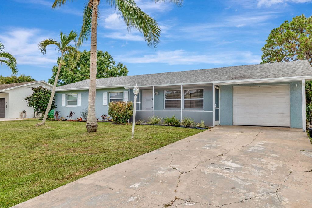 Photo of 1234 SE Petunia Avenue, Port Saint Lucie, FL 34952 (MLS # R11102278)