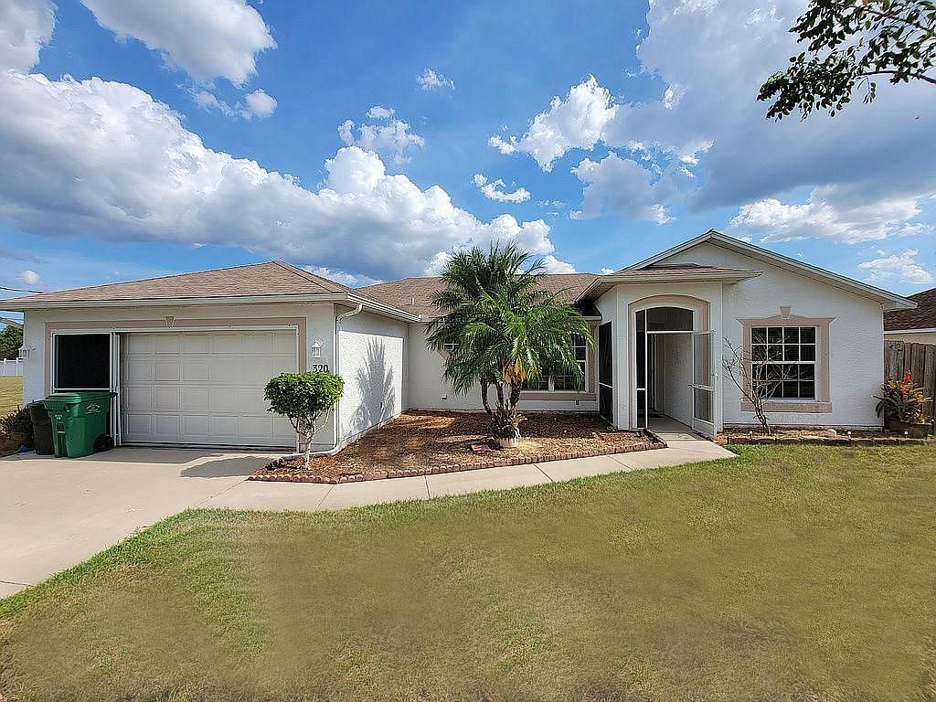 Photo of 320 SW Lacroix Avenue, Port Saint Lucie, FL 34953 (MLS # R10721930)