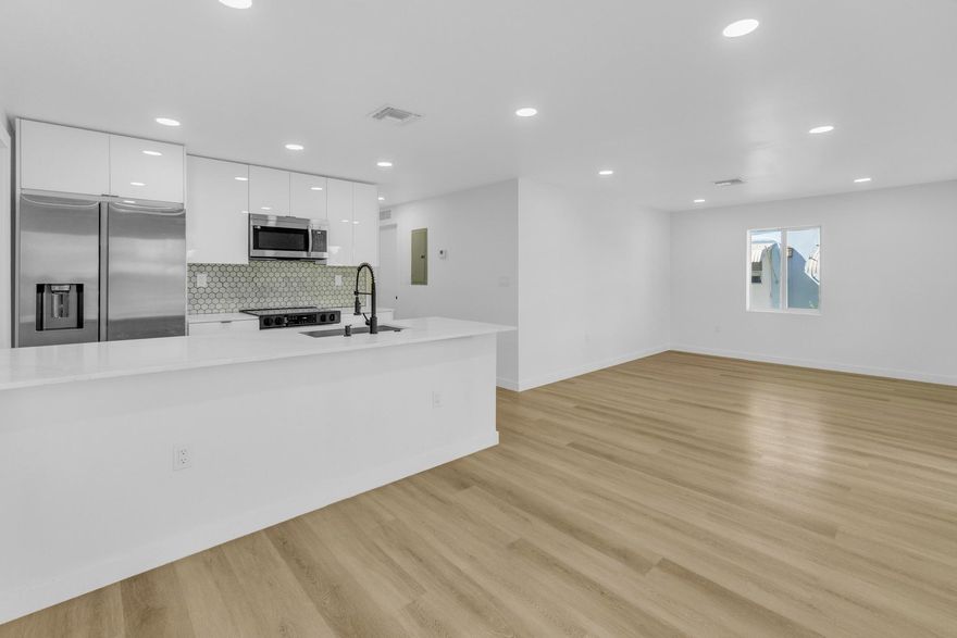 Discover this beautifully remodeled home in the heart of Miami-Dade County. Ideally located just 10 minutes from the airport, beaches, Downtown Miami, and Wynwood, this property offers both convenience and modern comfort. This stunning home features a brand-new roof, new A/C unit, new electrical panel, tankless water heater, custom closets, and frosted glass vanities. It has been fully insulated and includes impact windows and doors, providing significant savings on homeowners insurance and FPL bills. Enjoy an open-concept layout with new flooring throughout, new bathrooms, and a new kitchen complete with an island and stainless steel appliances. The property also boasts a spacious backyard, perfect for entertaining guests or providing plenty of room for kids to play.