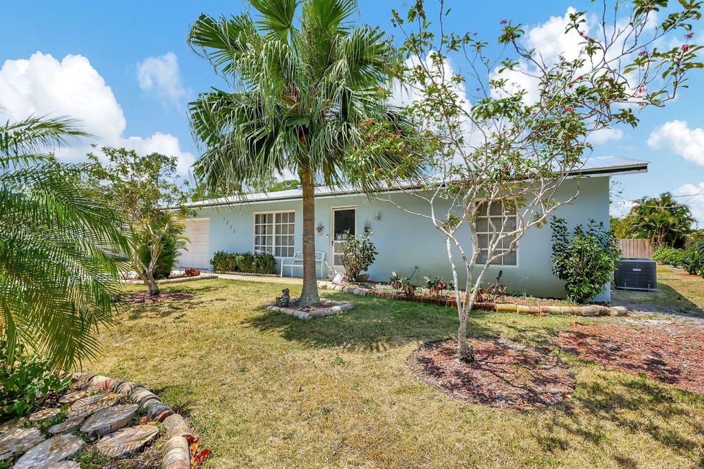 Photo of 1050 SE Proctor Lane, Port Saint Lucie, FL 34983 (MLS # R10982196)
