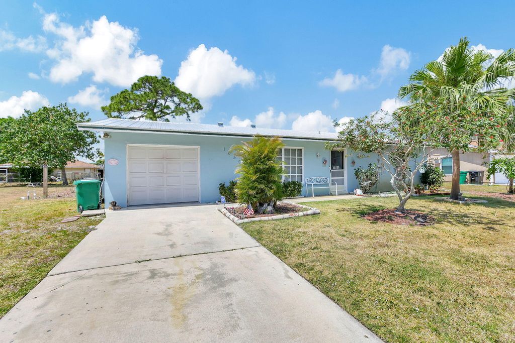 Photo of 1050 SE Proctor Lane, Port Saint Lucie, FL 34983 (MLS # R10982196)