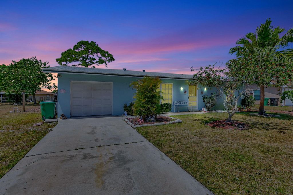 Photo of 1050 SE Proctor Lane, Port Saint Lucie, FL 34983 (MLS # R10982196)
