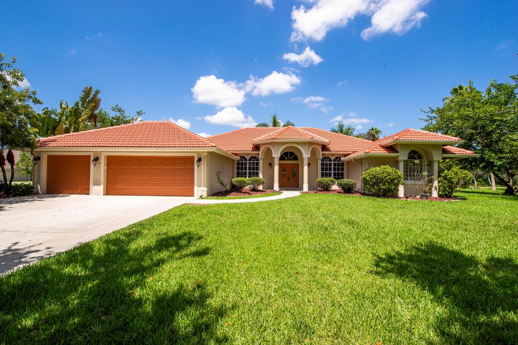 Photo of 5681 Lago Del Sol Drive, Lake Worth, FL 33449 (MLS # R11111266)