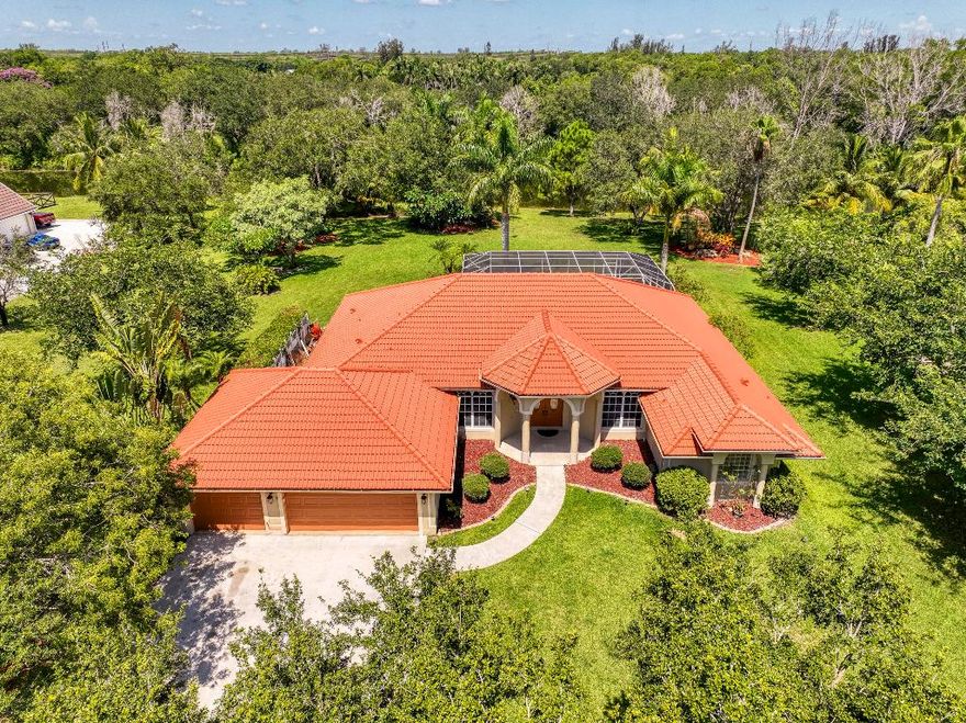 Motivated Seller! Welcome to this stunning single-family home located west of 441 and Lantana Road in beautiful Lake Worth! This spacious residence features 4 bedrooms, 2.5 bathrooms, and a 3-car garage which has been freshly painted, offering comfort and convenience for your family.  The kitchen has been updated with new quartz countertops and cabinet doors, along with fresh paint in the living room. Enjoy your own private oasis with a sparkling resurfaced and resealed pool and a screened patio, perfect for entertaining or relaxing. The home is surrounded by gorgeous landscaping and boasts an amazing lake view, providing peaceful and picturesque surroundings. Inside, you'll find generous living spaces filled with natural light, a modern kitchen, and ample storage. Don't miss this exceptional opportunity to own a well-maintained home in a prime location, schedule your private showing today.