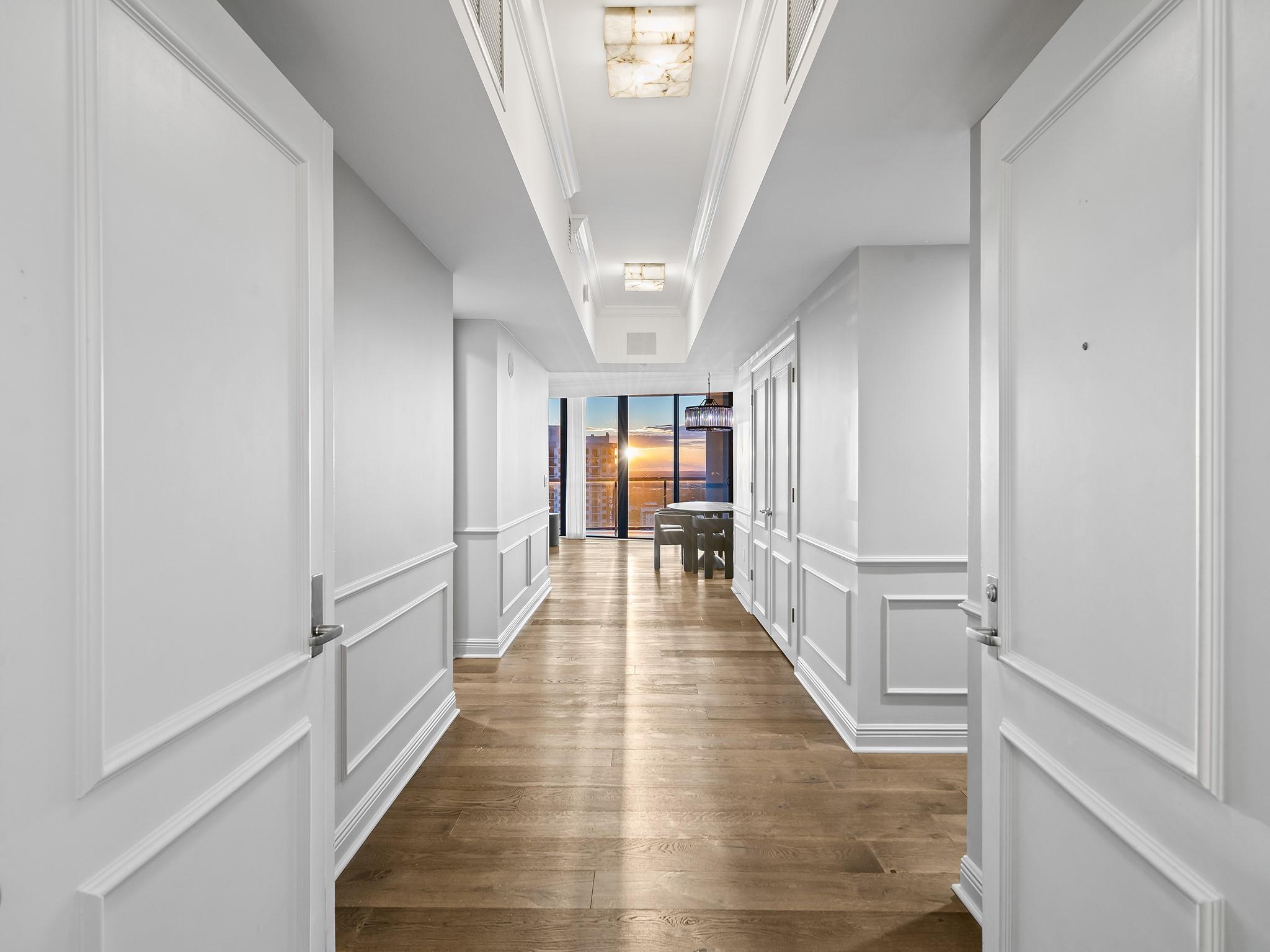 With over $500,000 in upgrades and the most expansive floor to ceiling condo views in Las Olas River House, this professionally designed Madison unit has everything and more. Spanning over 2700 square feet of living space this highly sought after floorplan features 3 bedrooms, 3.5 baths, Duchateu wood flooring and wainscoting throughout, stretch reflective ceiling, a home theater, and a wrap around balcony with views of the ocean, Ft Lauderdale airport, the New River, Huizenga Park and Downtown city skyline. Enjoy spectacular sunsets from your gourmet kitchen with Wolf induction cooktop, two Thermador ovens, two Sub-Zero fridges, marble countertops with Tuffskin protection, and two wine fridges. Sonos system, custom closets, marble baths, remote motorized blinds and custom drapery.