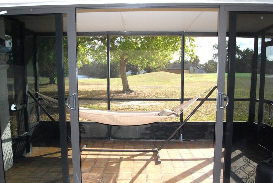 Experience serene waterfront living in this beautifully renovated villa nestled along the golf course. New flooring and stylish remodeled bathrooms, the home has a feeling of comfort with multiple outdoor spaces—including a screened lanai overlooking the water—create the perfect setting for relaxation or entertaining. The property also features a 4 yr old roof, impact windows and accordion shutters, impact one-car garage, a private driveway, and a fully irrigated garden. Set within a quiet, secure, all-ages community with no public roads, residents enjoy low HOA fees that include cable, internet, a resort-style pool, tennis courts, and golf course access.