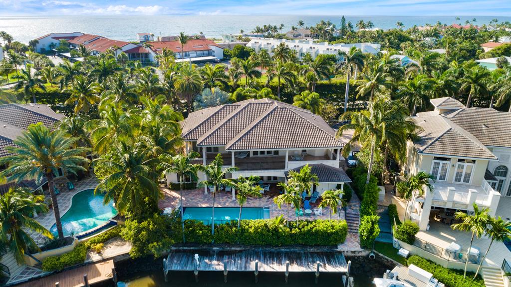 Ocean Harbour Estates is a gated, waterfront enclave of just 15 homes located in the beautiful, seaside town of Ocean Ridge, Florida just a few minute drive south of famed Palm Beach. Built in 2002, this traditional, Key West-inspired estate, has 5172 SF of air conditioned living space with 5 bedrooms, 4 full & 2 half bathrooms. The master suite is located on the 1st level along with an office/library, a den, an open great room, formal dining room & chef's kitchen well suited for entertaining. The 2nd floor has 4 guest bedrooms, 3 full bathrooms, a loft, plus an oversized covered terrace which overlooks the pool & canal leading out to the Intracoastal Waterway. Other features of this estate include deep water dockage, hurricane impact resistant glass & full home generator, beach access.