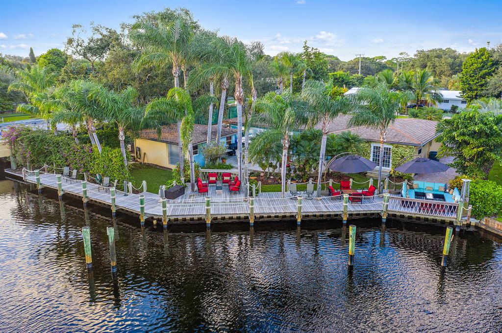 CHECK OUT VIDEO TOUR ! This Boaters Paradise Has Enchanting Backyard & Beautiful Water Views! Some Features Include 135' Of Waterfrontage, No Fixed Bridges, 120' Dock, Plenty Of Space On Side To Hide Your RV & Work On Your Hobbies, 1st Time Offered In 30 Years, Lush Landscaping, Great Design Out Back For Entertaining Over 100 People, 2017 Seawall & Dock, SE Exposure, NO HOA, County ONLY Taxes, Circular Driveway. Single Family Home Offers Impact Windows & Doors, Open / Split Floorplan, Double Oven & Subzero Fridge.