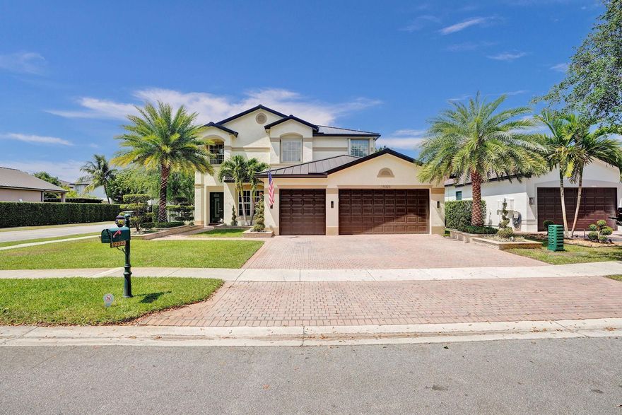 Beautifully updated and meticulously cared for by the original owners, this 5-bedroom, 3-bath home in the prestigious Isles at Sunset Lakes truly has it all. A 2022 metal roof with a 25-year transferable warranty ensures peace of mind. The newer split-zone AC system allows independent climate control on each level. The outdoor space is a showpiece, featuring lush landscaping, a custom-built kitchen and bar, and a sparkling saltwater pool that’s recently resurfaced with all new components. Inside, the expansive master suite boasts dual walk-in closets with custom built-ins. Rich solid wood flooring enhances the upper level, while the first floor showcases elegant tile throughout. The community offers 24-hour manned gates, roaming security, and access to top-rated “A” schools.