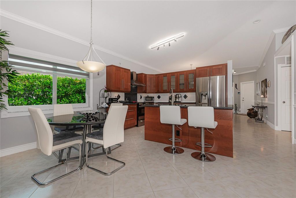 Photo of 1249 SW 46th Way, Deerfield Beach, FL 33442 (MLS # F10532159)