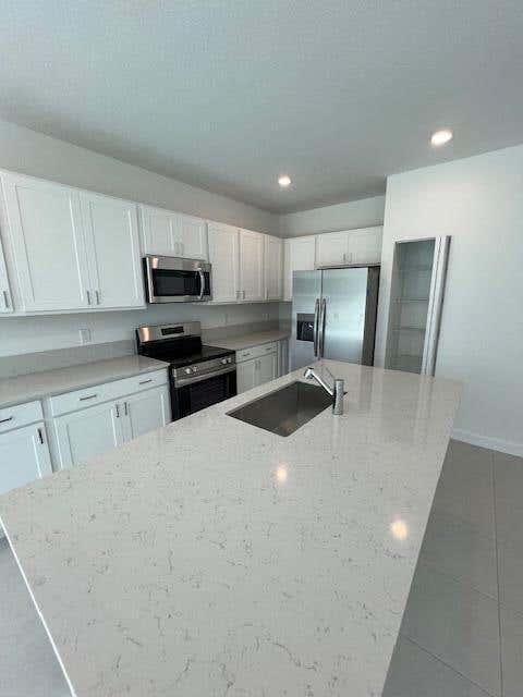 Photo of 5387 Flannigan Way, Greenacres, FL 33463 (MLS # B26012156)
