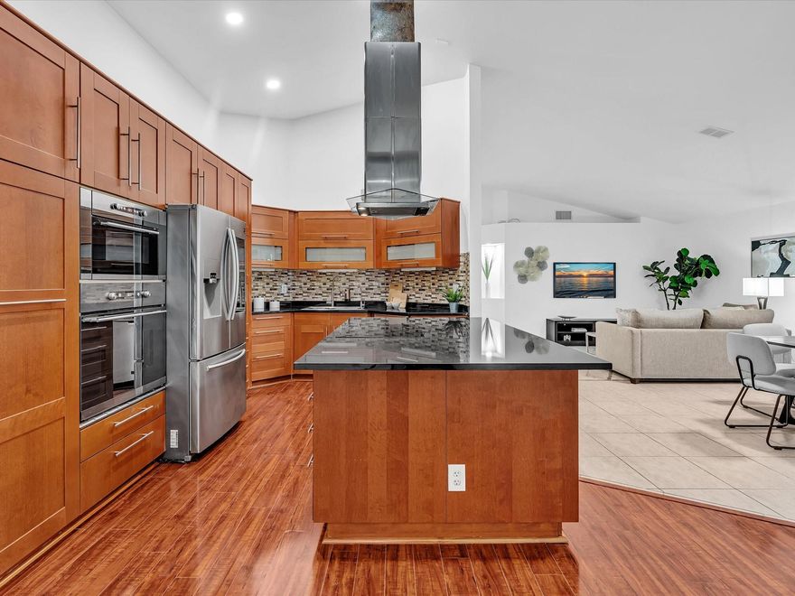 NEW 2025 TILE ROOF! Low HOA. Zoned for Cypress Bay. Located on a peaceful street that ends in a cul-de-sac, this residence features freshly painted interiors, smooth vaulted ceilings, and a naturally bright great room that gives the home a clean and airy feel.
The expanded kitchen—with abundant cabinetry, large island, induction cooktop, and smart-panel stainless steel refrigerator—sets the stage for preparing and enjoying dinner together.
The split layout offers a spacious primary suite with its own bath, two additional bedrooms with a beautifully remodeled second bath, plus laundry room, two-car garage, pavered driveway and entry, and accordion shutters. Photos have been added simulating one solid floor throughout.
Close to parks, shopping, top-rated schools, and I-75.