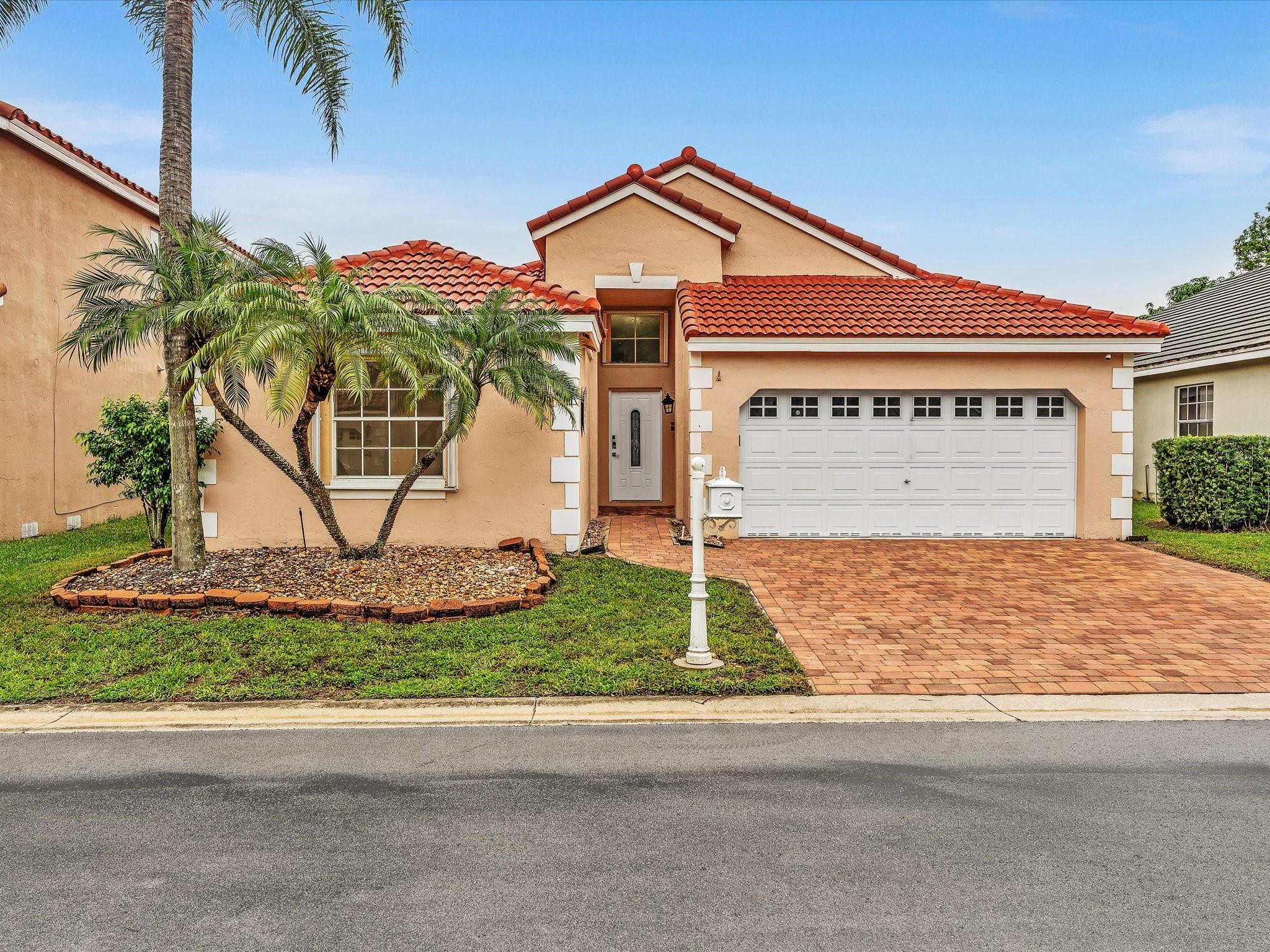 NEW 2025 TILE ROOF! Low HOA. Zoned for Cypress Bay.
Welcome to Bermuda Springs, a quiet community of only 206 homes. Located on a peaceful street that ends in a cul-de-sac, this residence features freshly painted interiors, smooth vaulted ceilings, and a naturally bright great room that gives the home a clean and airy feel.
The expanded kitchen—with abundant cabinetry, large island, induction cooktop, and smart-panel stainless steel refrigerator—sets the stage for preparing and enjoying dinner together.
The split layout offers a spacious primary suite with its own bath, two additional bedrooms with a beautifully remodeled second bath, plus laundry room, two-car garage, pavered driveway and entry, and accordion shutters.
Close to parks, shopping, top-rated schools, and I-75.