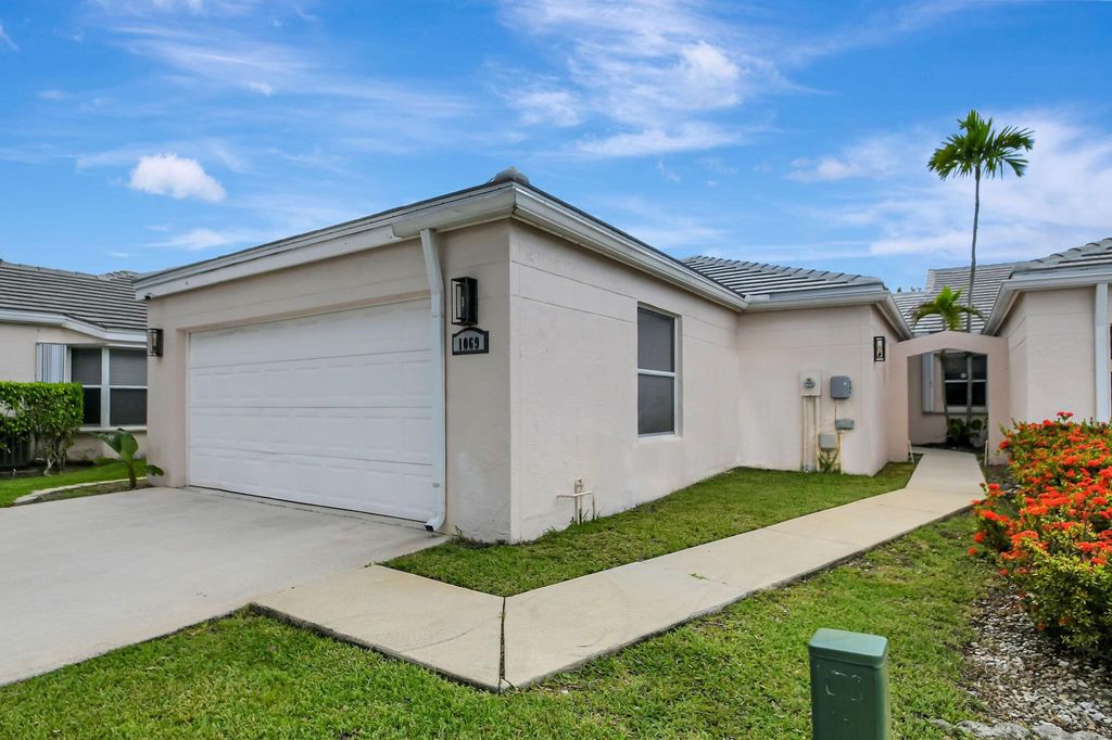 Photo of 1069 Island Manor Drive, Greenacres, FL 33413 (MLS # R11007766)