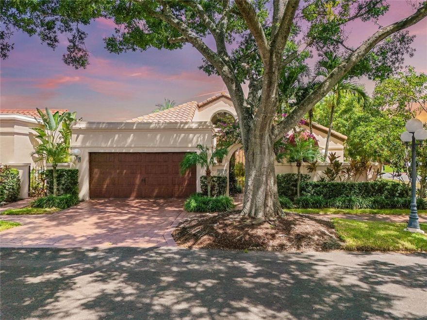 ABSOLUTELY STUNNING, one-of-a-kind designer home in the highly sought after community of Deercreek known as Villa D’Este of Deerfield Beach. PRIME CORNER LOT JUST STEPS FROM THE COMMUNITY POOL. Bright and open layout with two private bedrooms, two full baths, & a half bath powder room. Features include IMPACT WINDOWS, soaring arched ceilings with GORGEOUS WOODEN BEAMS, chef’s kitchen with Sub-Zero fridge, Wolf range, Thermador espresso maker, wine fridge, porcelain floors, solid wood doors, & a screened terrace overlooking a large paver patio ready for a private pool. Fully renovated with roof, A/C, and water heater in excellent condition. Chandeliers and furnishings not included unless negotiated. AMAZING SCHOOLS NEARBY.
